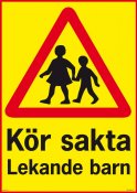 Varning kör sakta lekande barn skylt